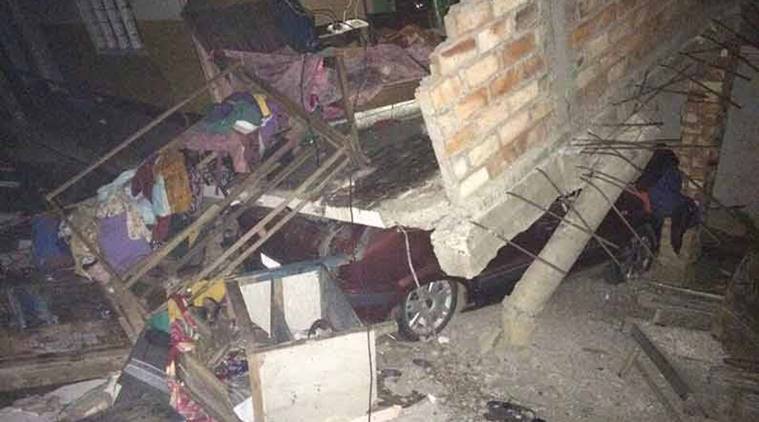 A car stucked or hit by destroyed house